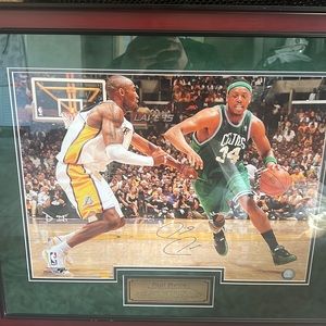 2008 championship photo of Paul Pierce MVP taking on Kobe Bryant